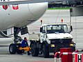 A Unimog being used as a pushback tractor