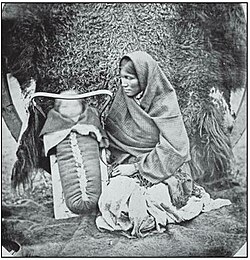 Ojibway woman with child in carrier basket. 1858. Library and Archives Canada/Credit: Humphrey Lloyd Hime/National Archives of Canada fonds/C-000728.