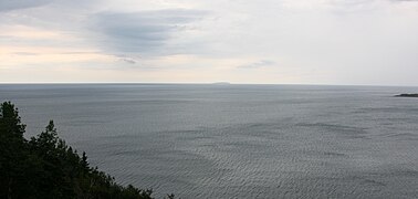 Cabot Strait,[30] from White Point, Cape Breton Island St. Paul Island[28] in the distance, Nova Scotia.