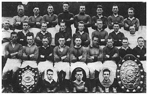 A group of footballers posing for a team photograph.