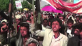 Protesters in Sanaa, Yemen, with placards of the Houthi slogan