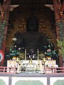 Daibutsu at Tōdai-ji with caretaker at it's base, Nara