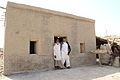 Two Sindhi muslim men wearing Sindhi Salwar Khamis and Godd with Sindhi rumals (handkerchiefs)