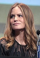 Jennifer Jason Leigh interprète Daisy Domergue, la Prisonnière.