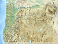 Mapa konturowa Oregonu, u góry nieco na lewo znajduje się czarny trójkącik z opisem „Mount Hood”