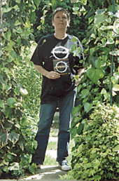 A middle-aged woman standing in a garden