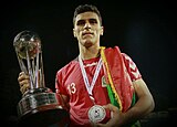 Afghanistan's Hamid Karimi holding the SAFF trophy after winning the 2013 SAFF Championship. Hamid Karimi.jpg