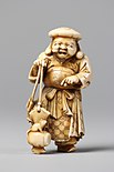 Ivory netsuke of Daikokuten with mallet and rat