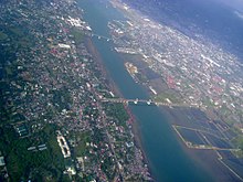 Aerial photo of the Mactan Channel looking south. Mandaue is on the right side while Lapu-Lapu City is on the left Metro Cebu-Aerial View.jpg