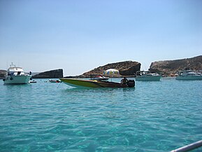 The Blue Lagoon at sea level with Cominotto in the background