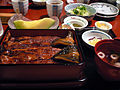 Photo of thin-sliced fish in restaurant setting