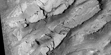 Mesas breaking up into blocks, as seen by HiRISE, under HiWish program