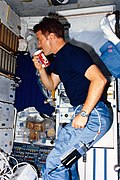 Tony England drinks Coca-Cola in space