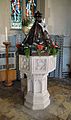 The baptismal font dates to about 1450