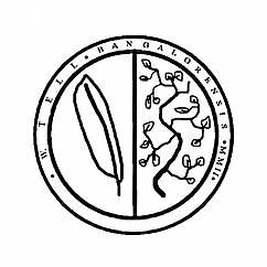 A coat of arms made by the user Wilhelm Tell DCCXLVI for himself. It is made up of a simple circular shield with two halves. The dexter half depicts a quill, to represent knowledge. The sinister half represents an olive branch, to symbolise peace. Around the shield is inscribed "W. Tell, of Bangalore, 2002" in possibly un-grammatical Latin.