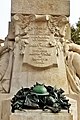 The shield with an inspiration at the back of the monument.