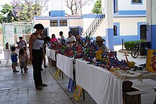 Woman at weekly Friday alebrije tianguis in San Martin Tilcajete WomanAlebrijesTilcajete.JPG