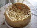 Casu martzu, a rotten cheese from Sardinia, Italy, is a traditional sheep milk cheese that contains live maggots as well as cheese mites