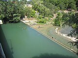 Waders cool off in the Medina River in Castroville.