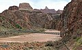 Zoroaster Temple and Sumner Butte (left) seen with footbridge over Colorado River