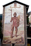 Fresque dédiée à saint Maurice sur la place du marché, avec la devise « en adversité, bon cœur », ajoutée au blason de la ville en 1565 par le duc Emmanuel-Philibert.