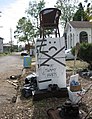 Cleanup begins: Trashed appliances arranged as folk art