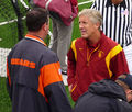 Pete Carroll talks to an NFL scout