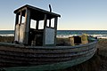 Old fisherboat at the beach of Zingst