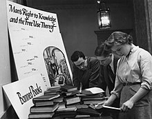 Students examining a display in Butler Library on banned books ColumbiaBannedBooksPanel.jpg