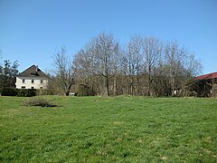 The Saint Joseph well, is located behind the trees beneath the building.