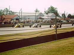 The front row during the pace lap. From left to right: Al Unser, Sr. (outside), Danny Sullivan (middle), Rick Mears (pole position) 1988Indy500frontrow.jpg