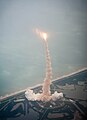 Launch of Atlantis viewed through the window of a Shuttle Training Aircraft.