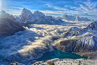 Cholatse mountain range, Ngozumpa Glacier, Gokyo Lake and a sea of clouds. Photograph: Yash Bhattarai