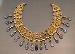 Collier; late 6th–7th century; gold, an emerald, a sapphire, amethysts and pearls; diameter: 23 cm (9.1 in); from a Constantinopolitan workshop; Antikensammlung Berlin (Berlin, Germany)[310]