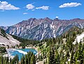 Twin Peaks (left), O'Sullivan Peak (center), Dromedary Peak (right, under cloud), viewed from the south with Red Pine Lake.