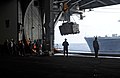 Moving pallets into the hangar of USS Enterprise, 2010.