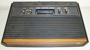 Atari 2600 four-switch "wood veneer" version, while the original 2600 had six switches.