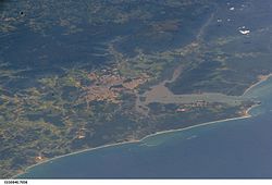 ISS image from 2005 showing the city of Joinville (center) with the Baía da Babitonga, Araquari (center below), to the right São Francisco do Sul with the coast of the South Atlantic.