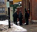Police detain three members of anonymous videotaping and photographing the Church and pictured here, the officer confiscates the tape.