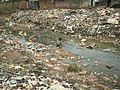 Child in open sewer in Nigeria (3150664698).jpg