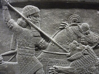 Assyrian relief; King Ashurbanipal spears a lion