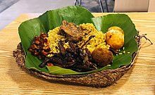 Lamprais, comprising chicken, egg, cutlet, fried eggplant and ash plantain Lamprais (Sri Lankan cuisine).jpg