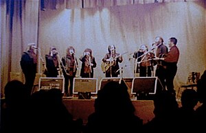 Blue Murder live at Montgomery Hall, Wath-upon-Dearne, 1 November 1987. Left to Right: Heather Brady, Lal Waterson, Rachel Waterson, Norma Waterson, Martin Carthy, Mike Waterson, Dave Brady, Jim Boyes. Photograph by Kevin Boyd.