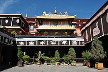 Temple courtyard with potted shrubs