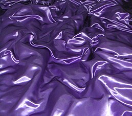 Originally, satin was made using silk, which is a long, continuous thread pulled from a silkworms cocoon. Modern satin can also be made from polyester and rayon, both of which can be manufactured to form long filaments. There are several different kinds of satin weaves:. 4 harness satin weave. Satin bedding.jpg