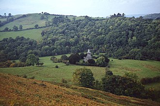 View of the church and surrounding earthworks Cefnllys Church.jpg