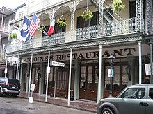 Antoine's restaurant is located in the French Quarter of New Orleans. FQ8Oct07AntoinesBalcony.jpg