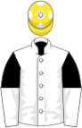 White, black and white halved sleeves, yellow cap, white spots