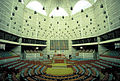 Image 40Jatiyo Sangsad Bhaban is the National Assembly Building of Bangladesh, located in the capital Dhaka. It was created by architect Louis I. Kahn and is one of the largest legislative complexes in the world. It houses all parliamentary activities of Bangladesh. This photo offers a view of the assembly hall inside the parliament building Photo Credit: Rossi101