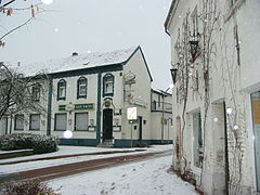 Snow falling in a German city.